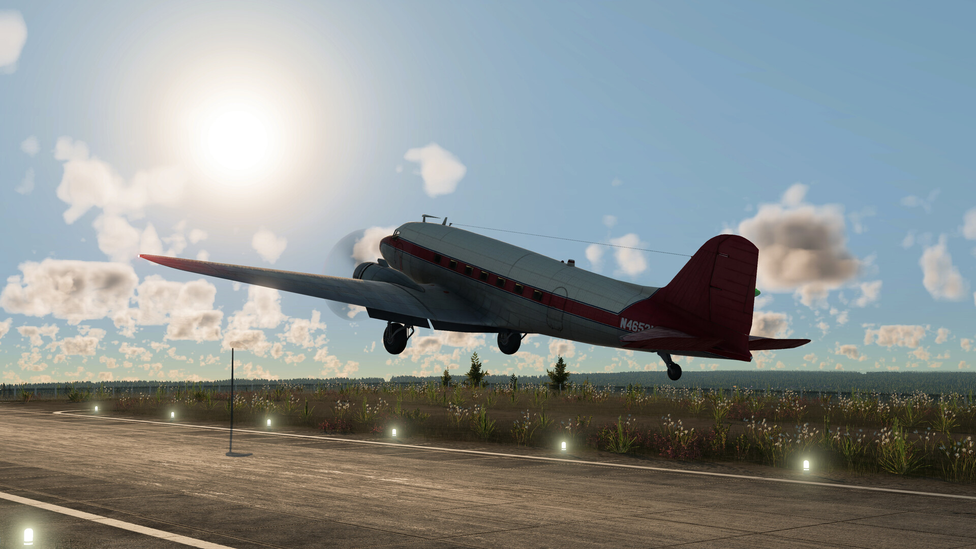 A vintage twin-propeller airliner lifting off a runway in golden light